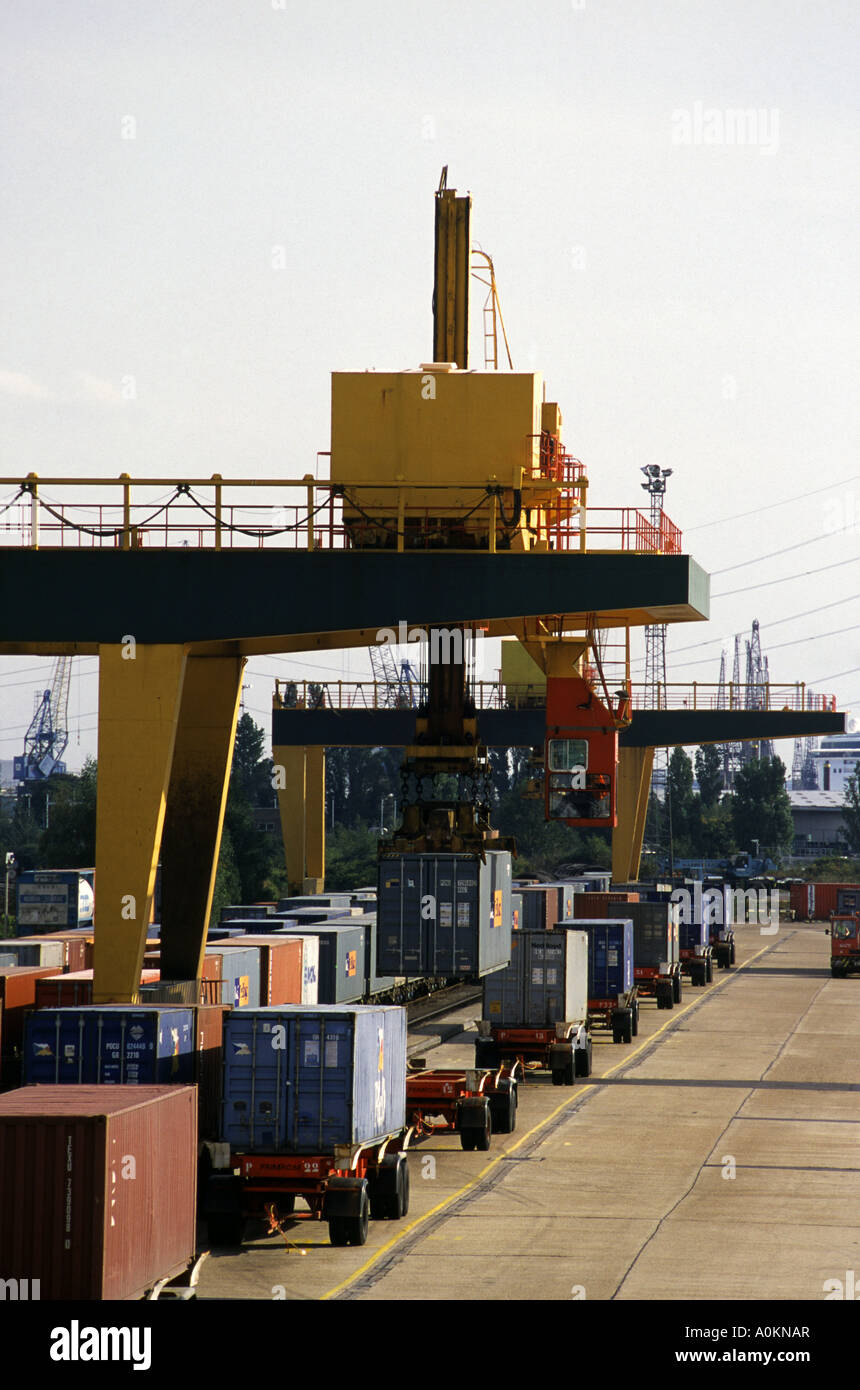 Portainer crane at Southampton Freightliner Terminal lifting a 20 foot container from a railway carriage Stock Photo