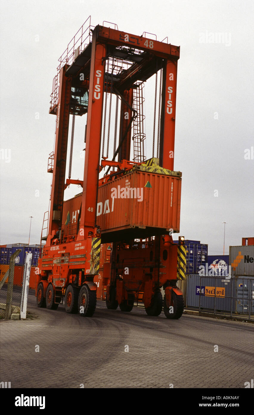 A straddle carrier moving a 40 foot container in the container stack at Southampton Container