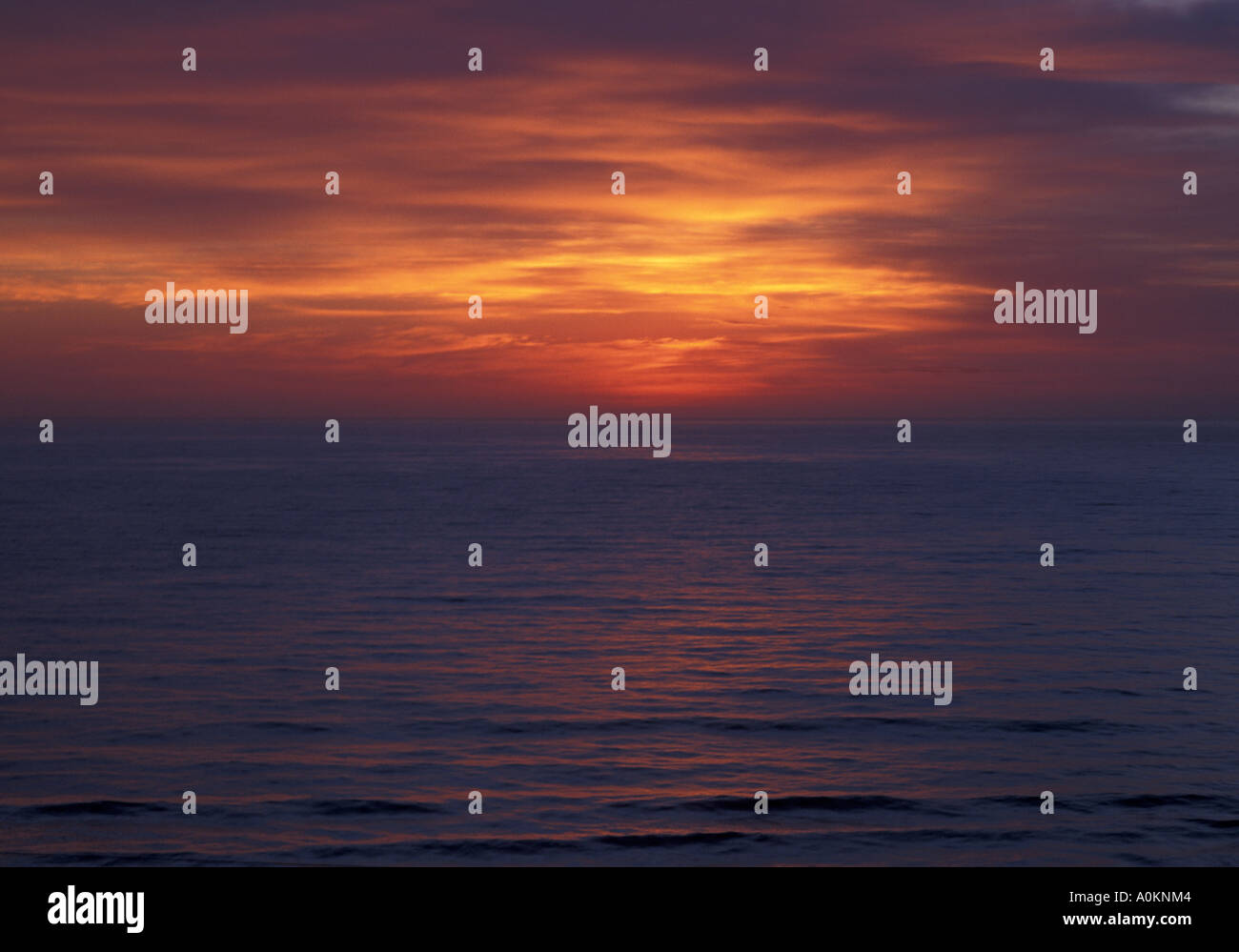 An abstract orange red blue pastel coloured  sunrise over the south pacific taken from Gt Ocean Rd Australia. Stock Photo