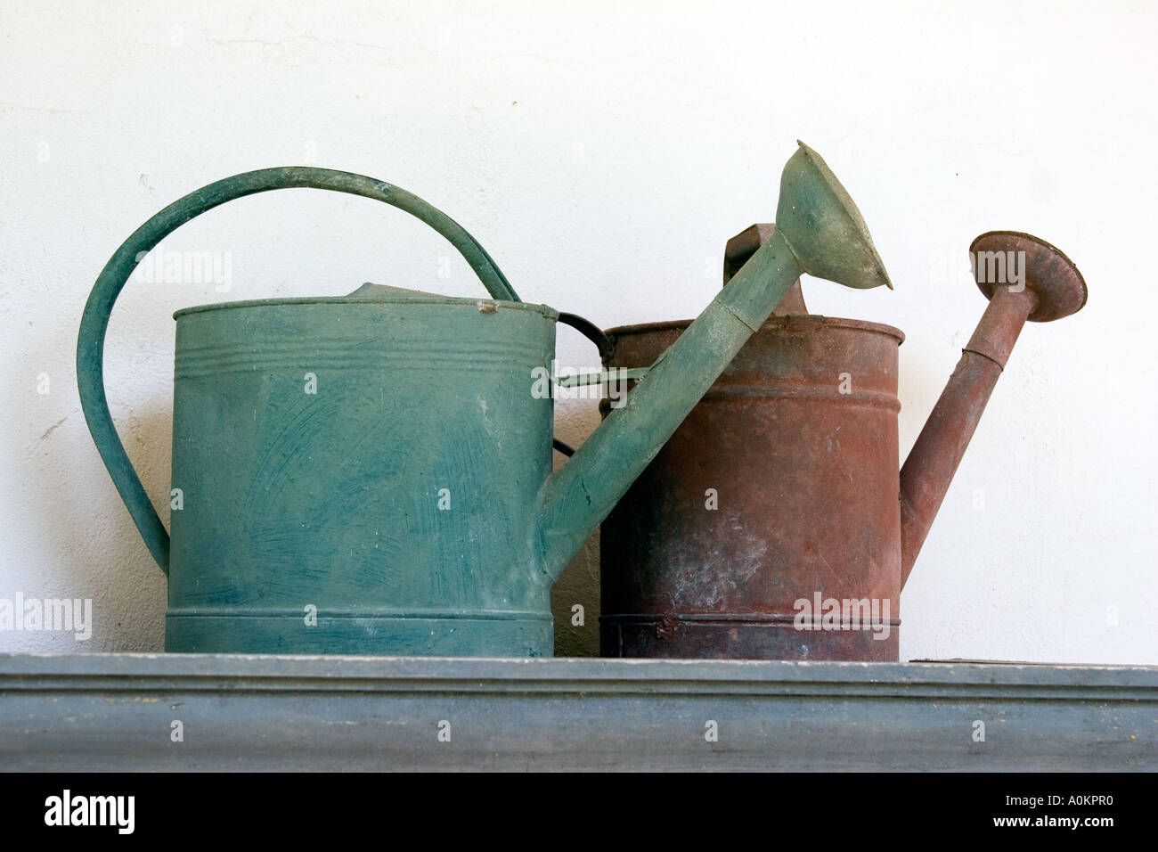 Antique watering cans Stock Photo Alamy