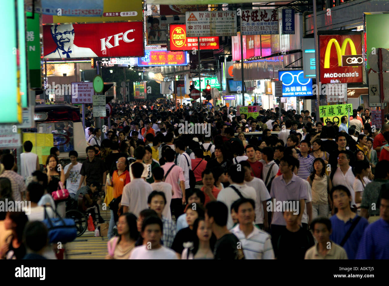 Sea of people every night outside stores,  shops and restaurants in Mong Kok Night  Market, Hong Kong SAR, China Stock Photo