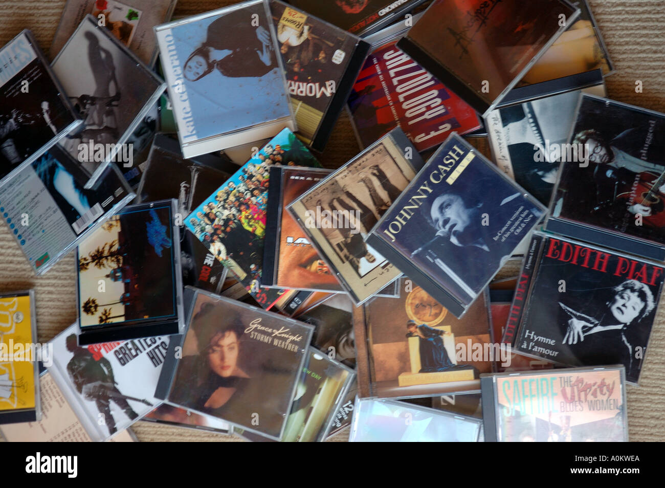 jumble of CD covers on floor dsca 0590 Stock Photo