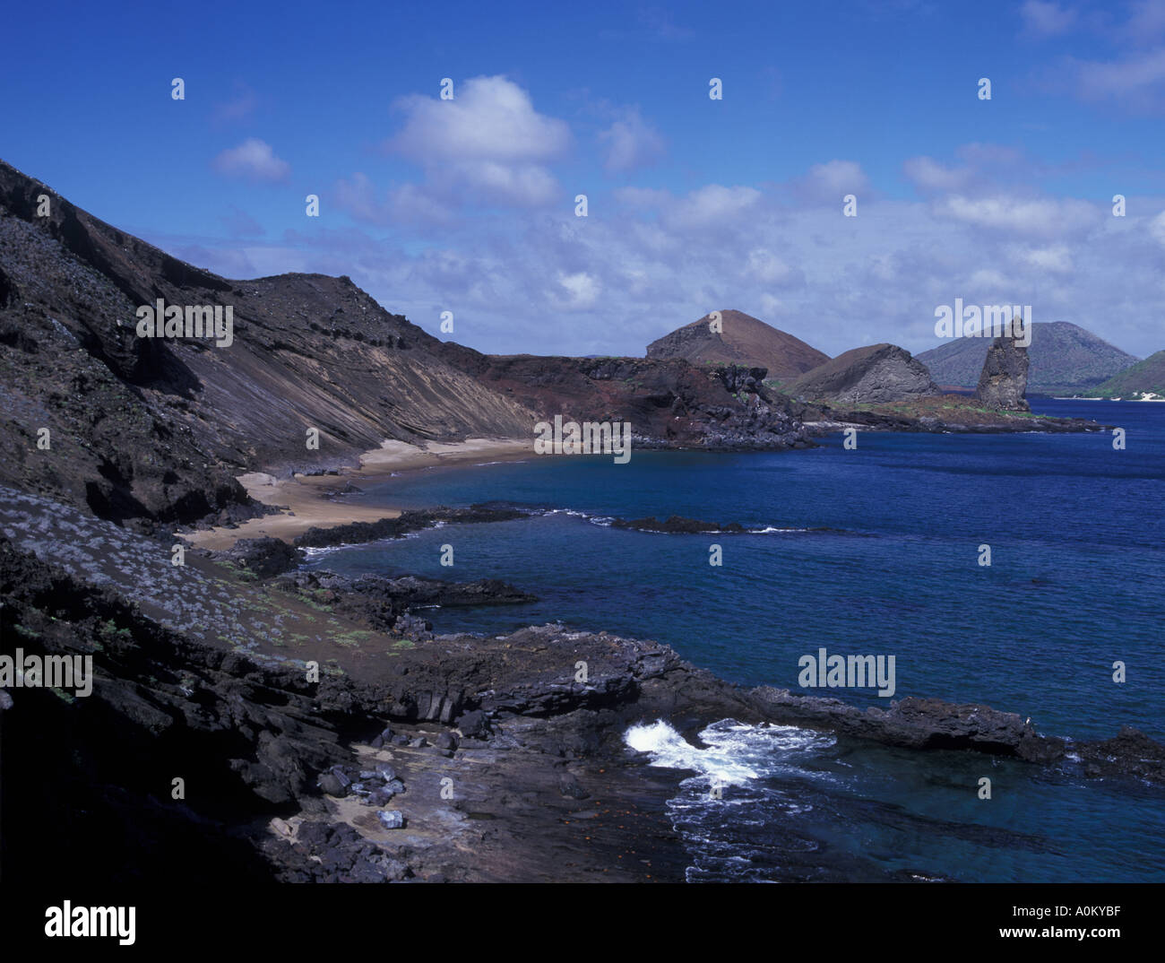 Galapagos Volcanic rocky shore line including pinnacle rock the remaining piece of Stock Photo