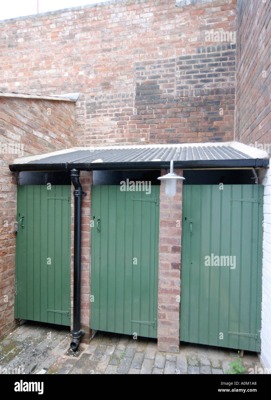 Toilet block of a row of back to back houses in Hurst Street Birmingham England Stock Photo