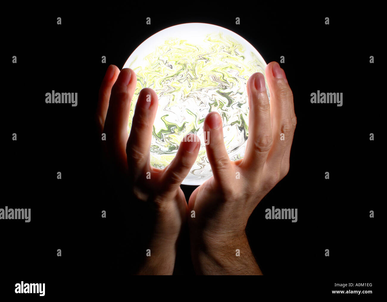 Hands holding crystal ball hires stock photography and images Alamy