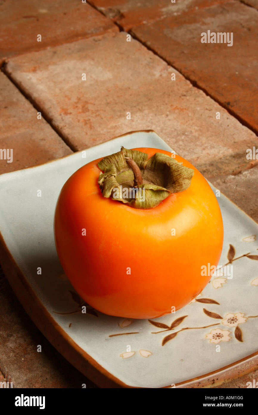 A Giant Sharon fruit Stock Photo Alamy