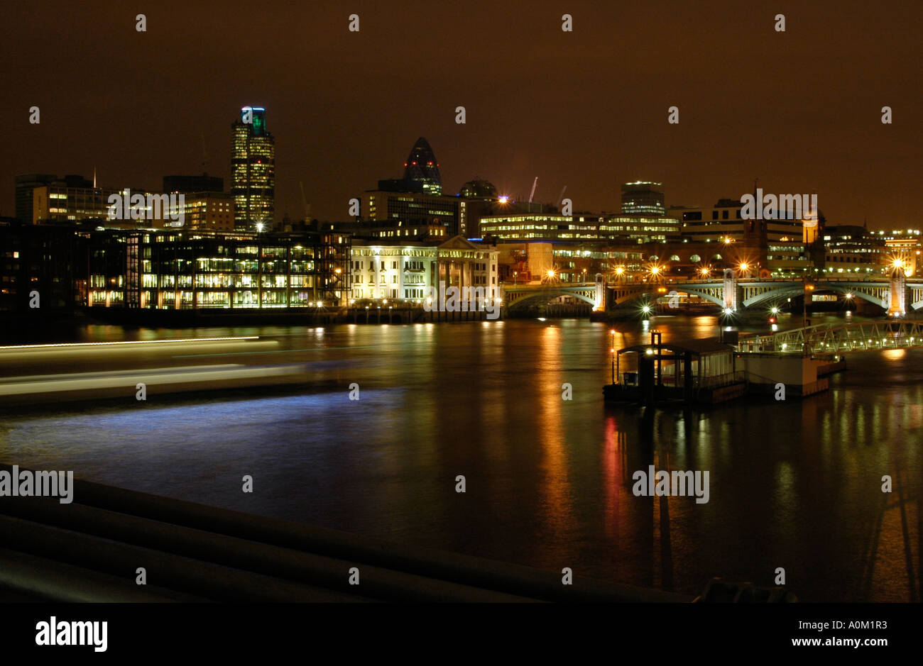City of London at Night from the Millennium Bridge Stock Photo