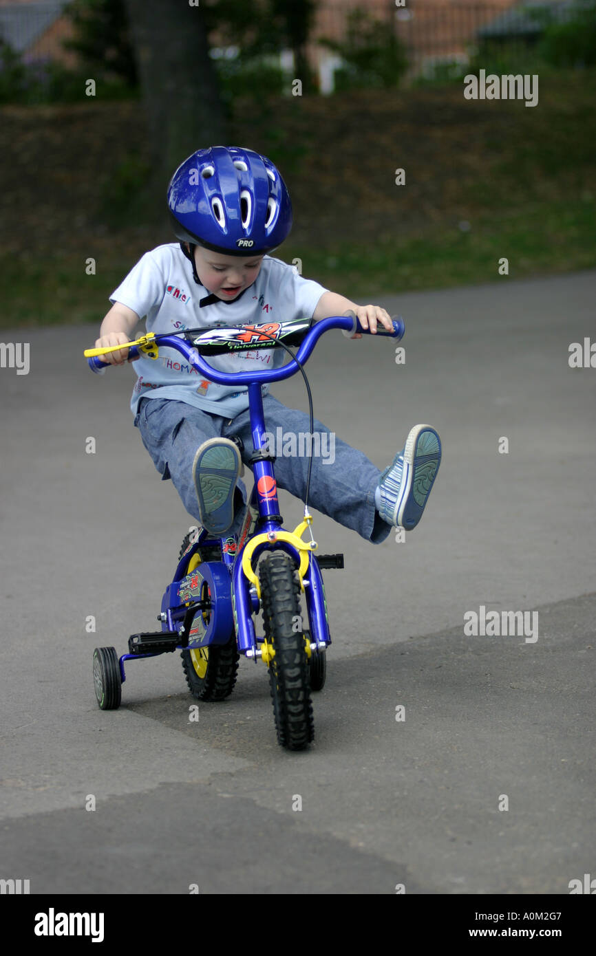 Lewis Riding Lewis riding his new bicycle wearing his new cycle helmet Stock Photo ...