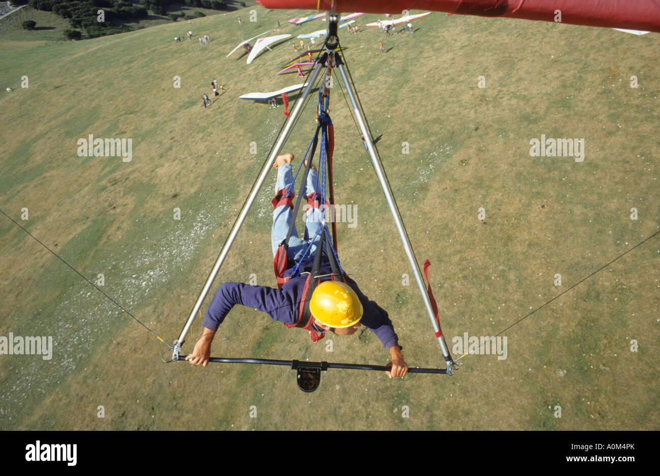 Hang Gliding Pilot making a self portrait flying over Take Off Area on Monte Cucco Umbria Italy Model released self portrait Stock Photo