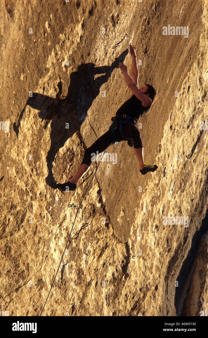 Rock Climber in very difficoult climbing route in Buoux Haute Provence