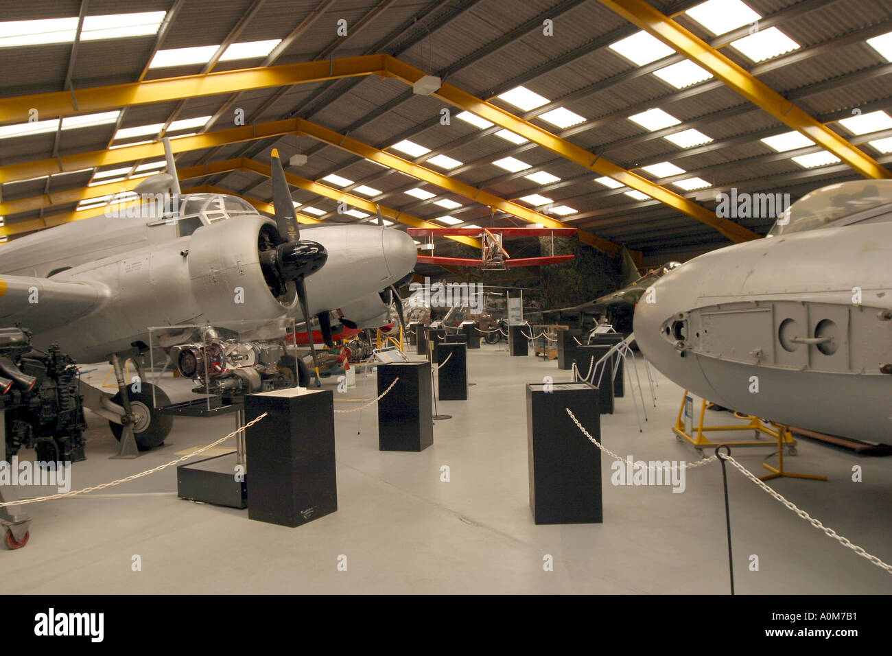 Newark Air Museum Inside the main hall Avroe Anson on the left Meteor on the right Stock Photo