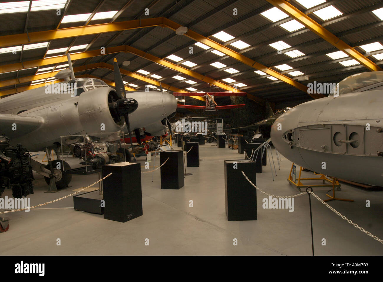 Newark Air Museum Inside the main hall Avroe Anson on the left Meteor on the right Stock Photo
