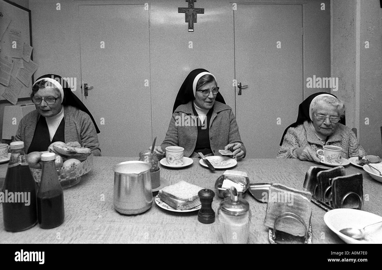 Nuns at breakfast Picture by Andrew Hasson 1989 Stock Photo
