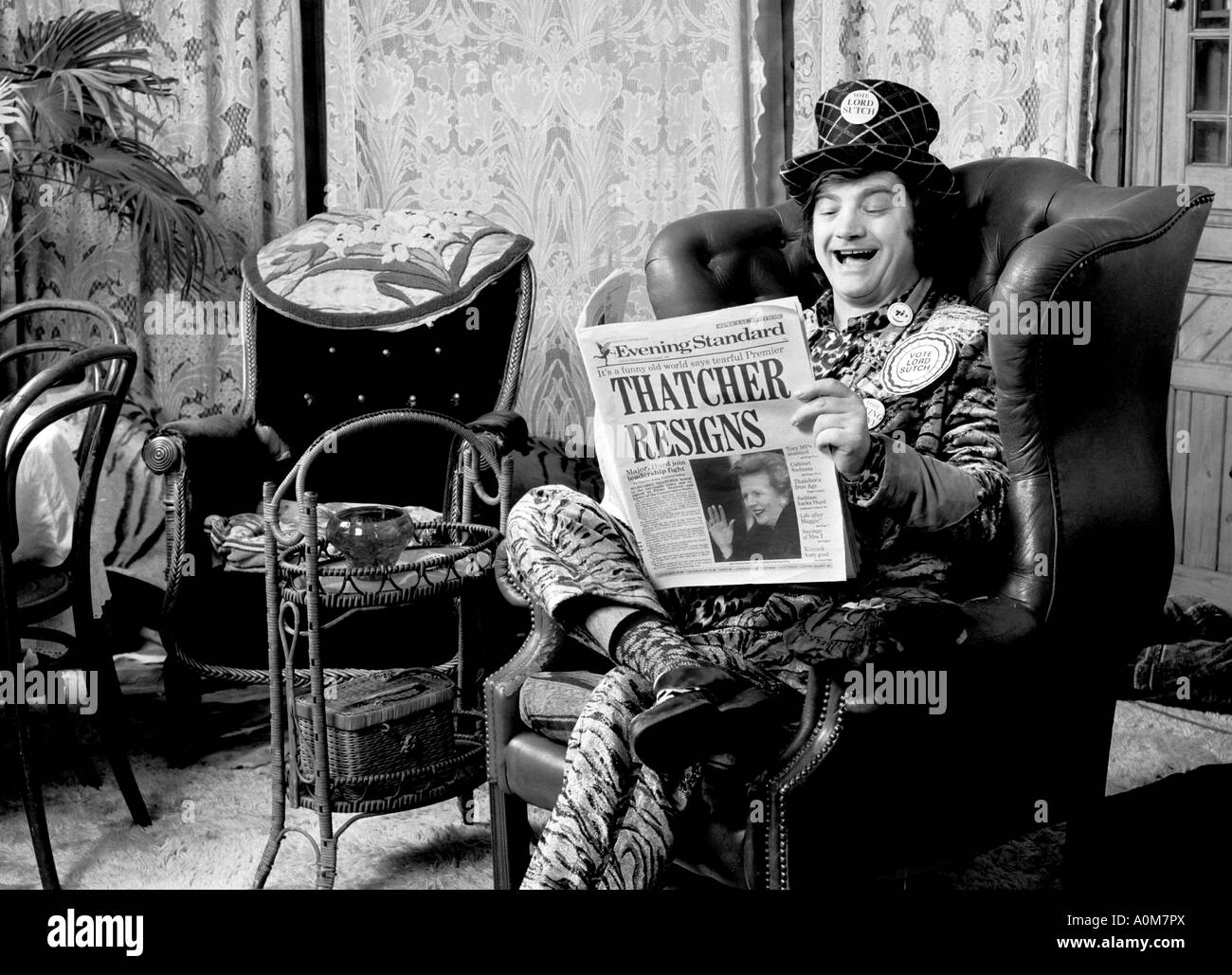 Screaming Lord Sutch at his home reading news of Mrs Thatchers resignation. Stock Photo