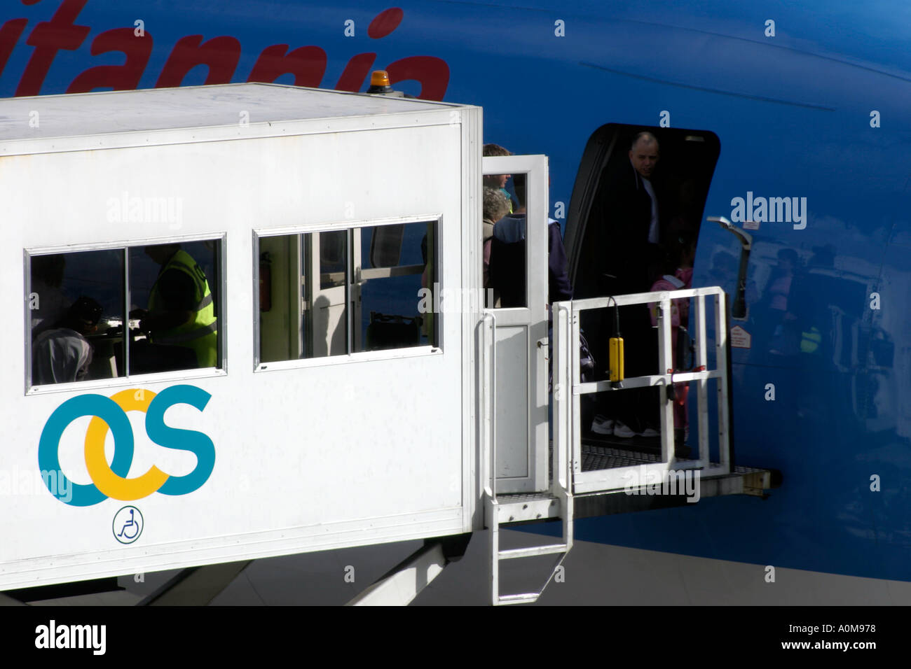 Disabled passengers boarding an aircraft via special mobile lift Stock