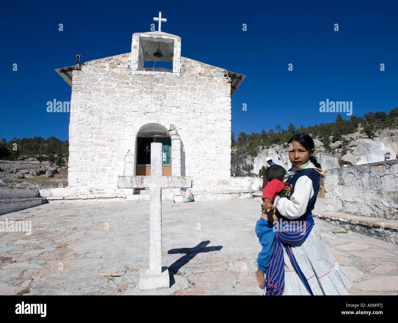 Woman and child in front of the church at Mission San Luis Majimachi a Tarahumara indian community near Copper Canyon Stock Photo