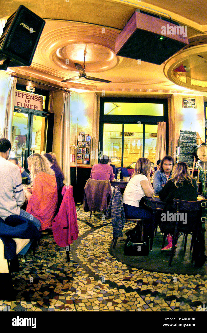 French Restaurants, PARIS France, Cafe 'Polichinelle Café'  Inside with Groups of People sitting at tables at Night, bistro interior bistrot, Stock Photo