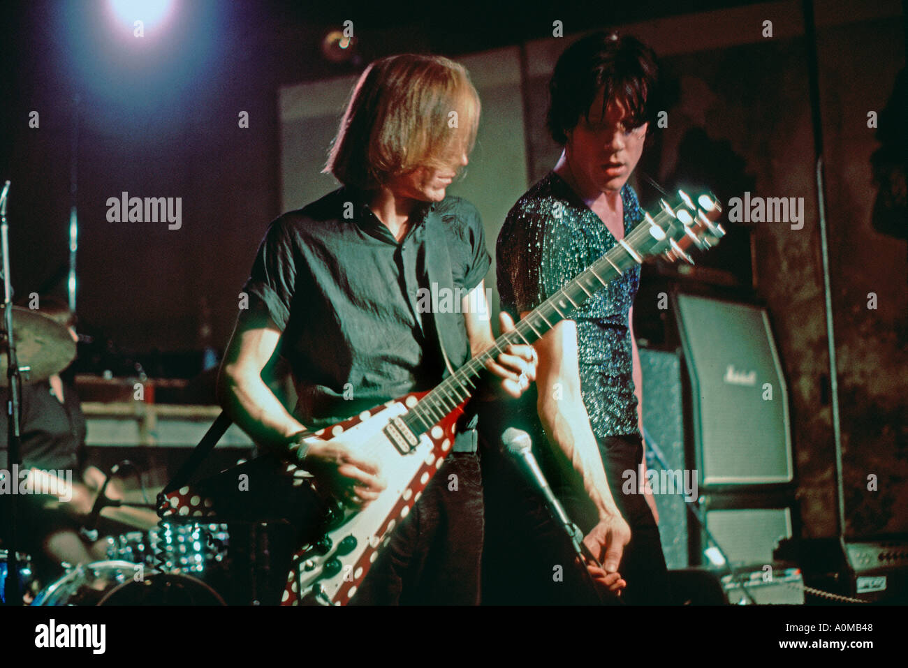New York NY USA 'CBGBs » Two Nightclub Interior Scene with 'The Cramps' Androgenous Males Performing Punk Rock Guitarist making rock music 1977 punk Stock Photo