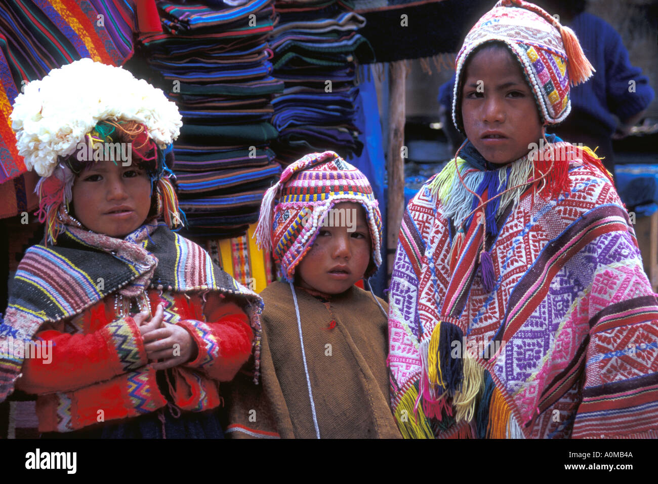 Peru Pisac traditionally dressed indigenous children in market Stock Photo