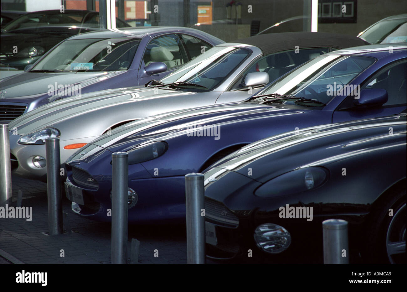 Aston Martin Sportscars lined up outside showroom in Water Lane