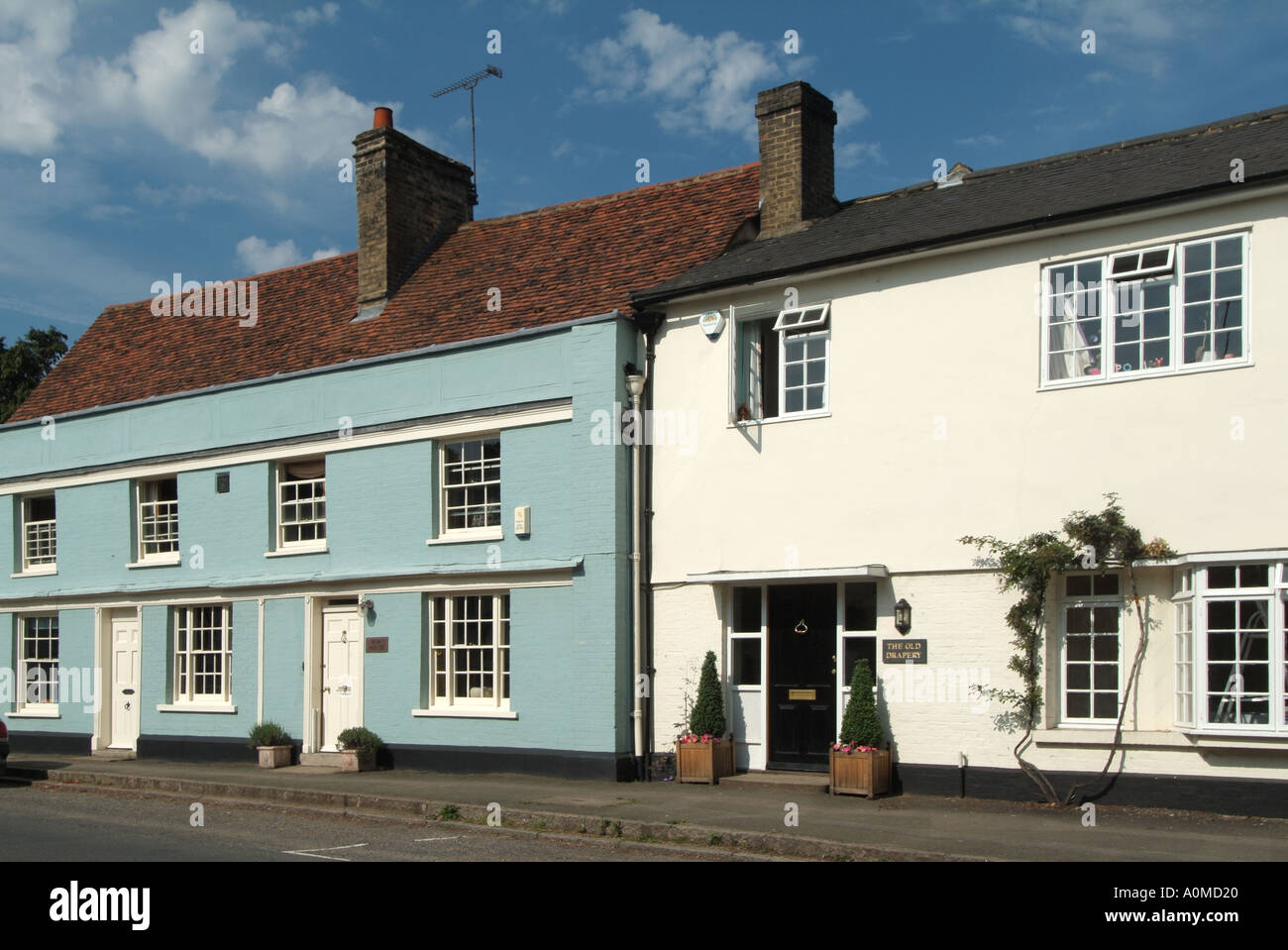 Much Hadham village with colour washed properties facing directly Stock Photo Alamy