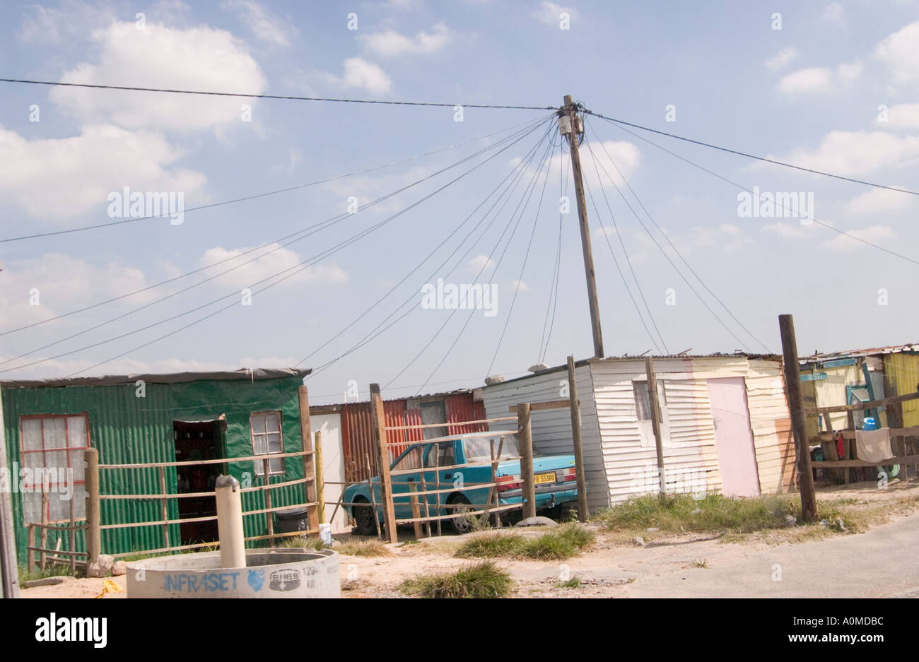 Some shacks in the Township of Khayelitshu with powerlines overhead Stock Photo