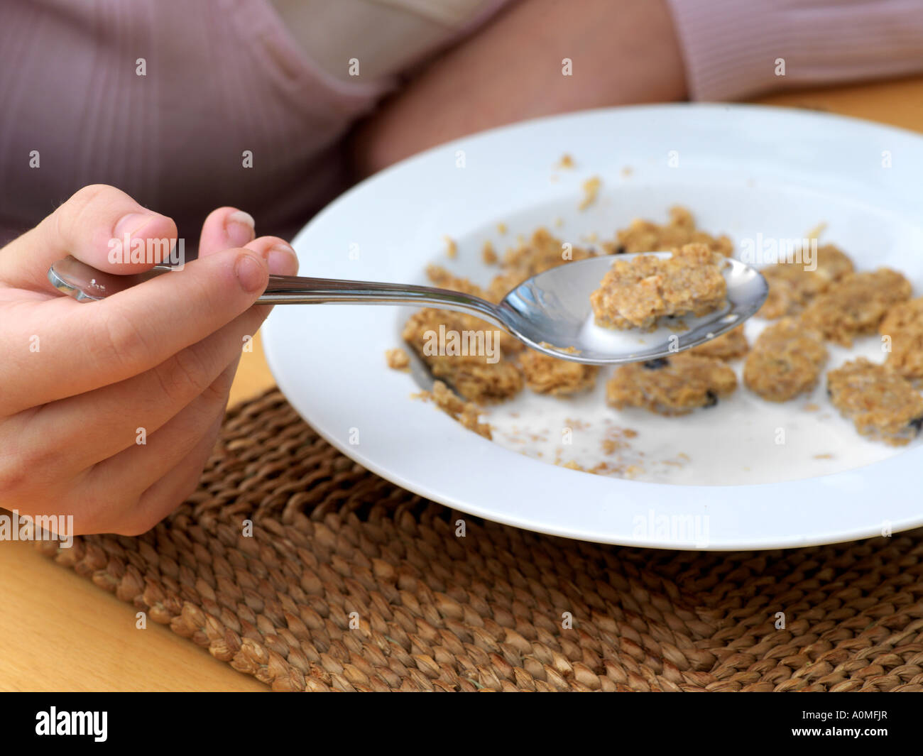 Teenager Eating Cereal for Breakfast Stock Photo