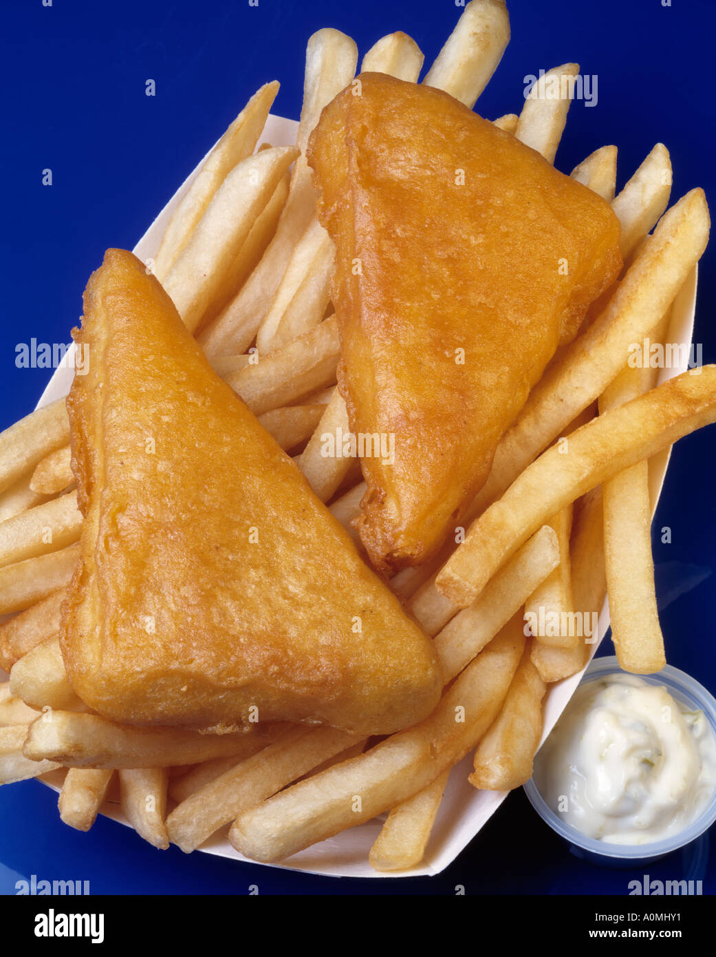 fish chips french fry fries tartar sauce blue background seafood breaded deep fried seafood Bon