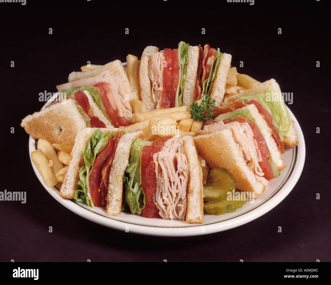 turkey club sandwich bacon lettuce tomato tomatoe chips french fry
