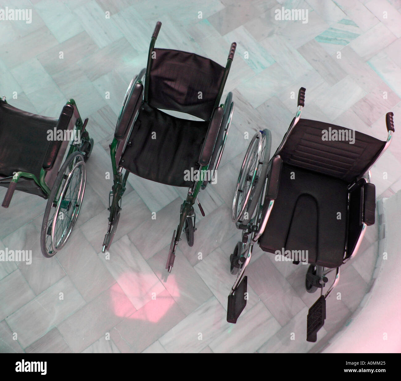 Three wheelchairs Stock Photo
