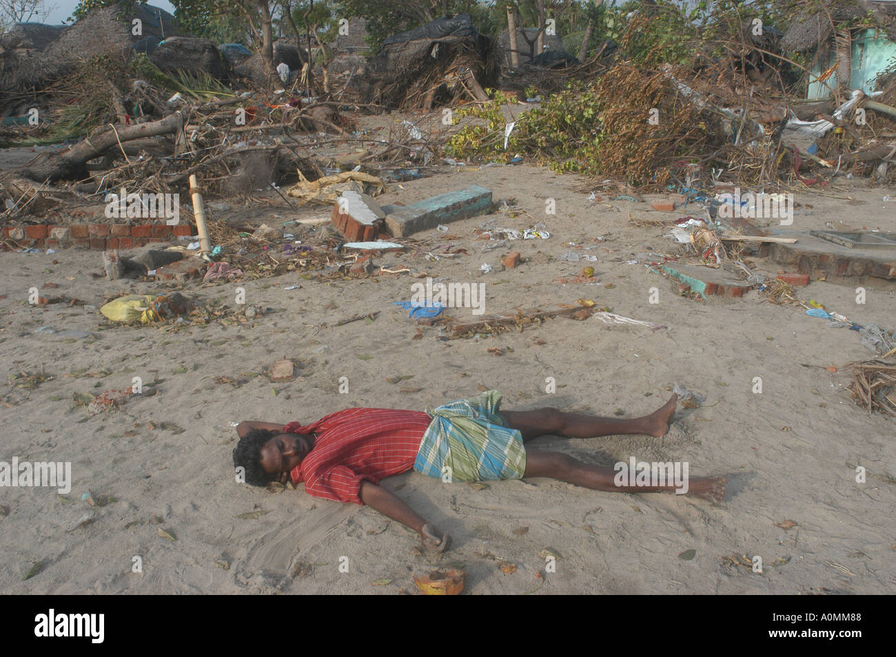 man lying dead waiting to be picked up after Tsunami earthquake Nagapattinum Velankanni Tamil Nadu India Stock Photo