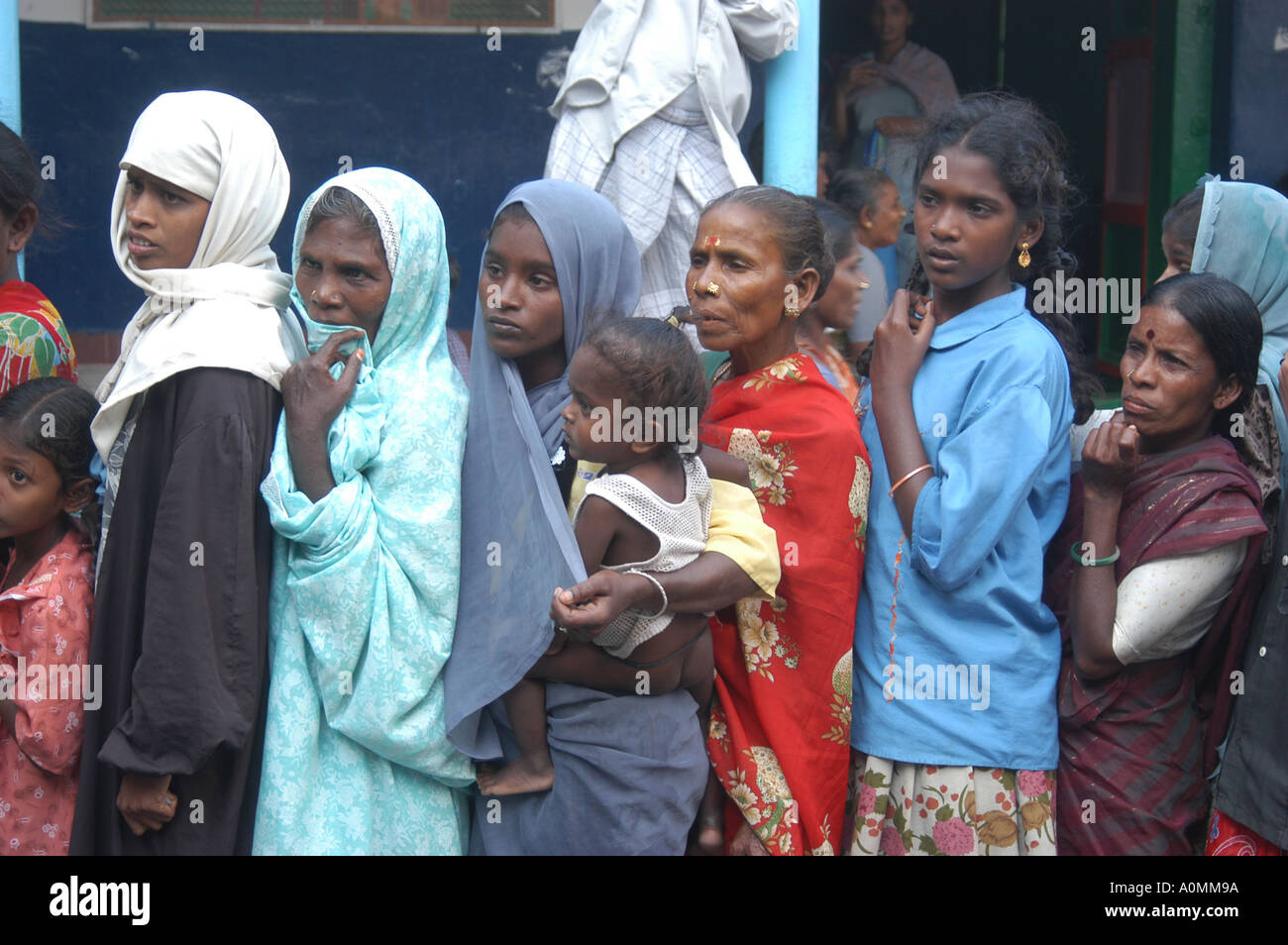 children in queue waiting for aid after Tsunami earthquake on sea floor Nagapattinum Velankanni Tamil Nadu Stock Photo