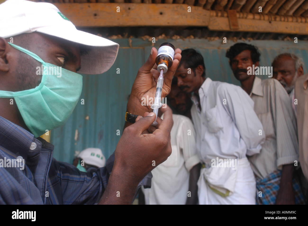 Doctor preparing injection in hospital for preventive care after Tsunami earthquake Nagapattinum Velankanni Tamil Nadu India - mpd 92661 Stock Photo