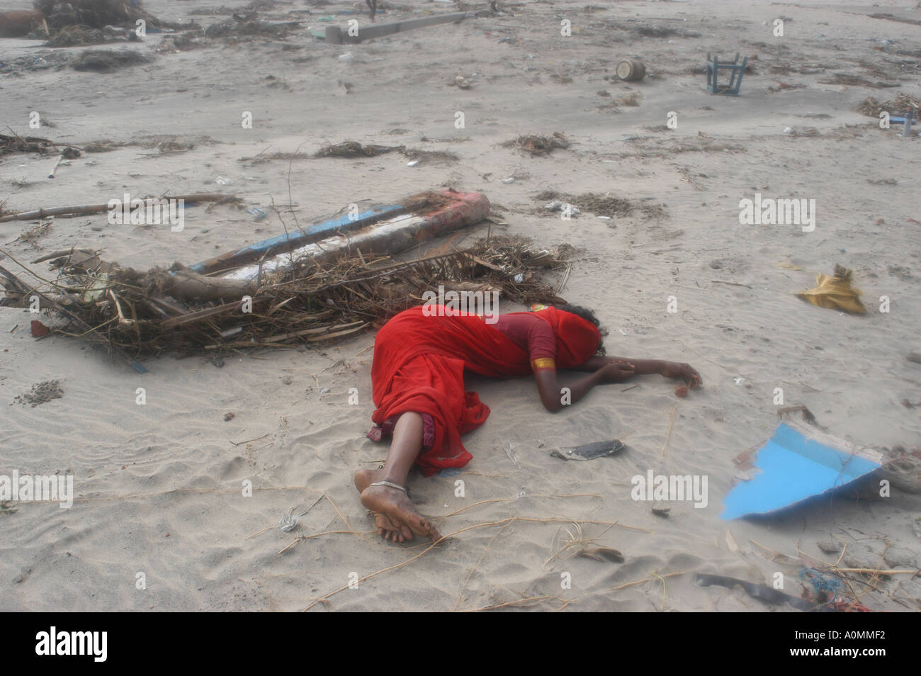 women lying on the ground full of grief at the loss of her family Tsunami earthquake Nagapattinum Velankanni Tamil Nadu India Stock Photo