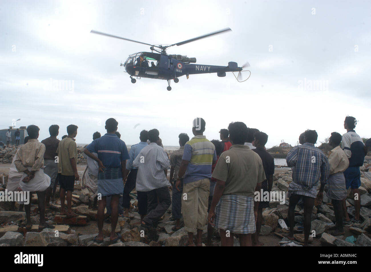 helicopter arriving with aid water food medicines Tsunami earthquake on sea floor Nagapattinum Velankanni Tamil Nadu India Stock Photo