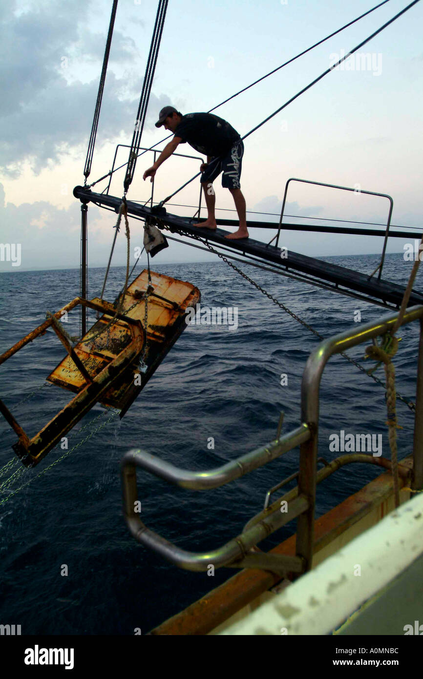 A deck hand working at prawn trawling at Southport Queensland Australia photos by Bruce miller 11 2004 Stock Photo