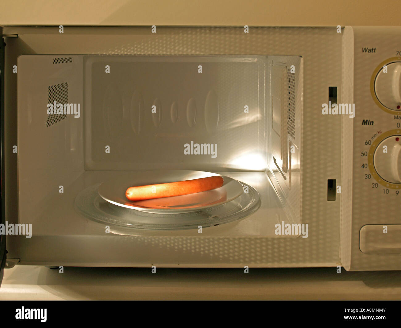 sausage in a microwave oven Stock Photo - Alamy