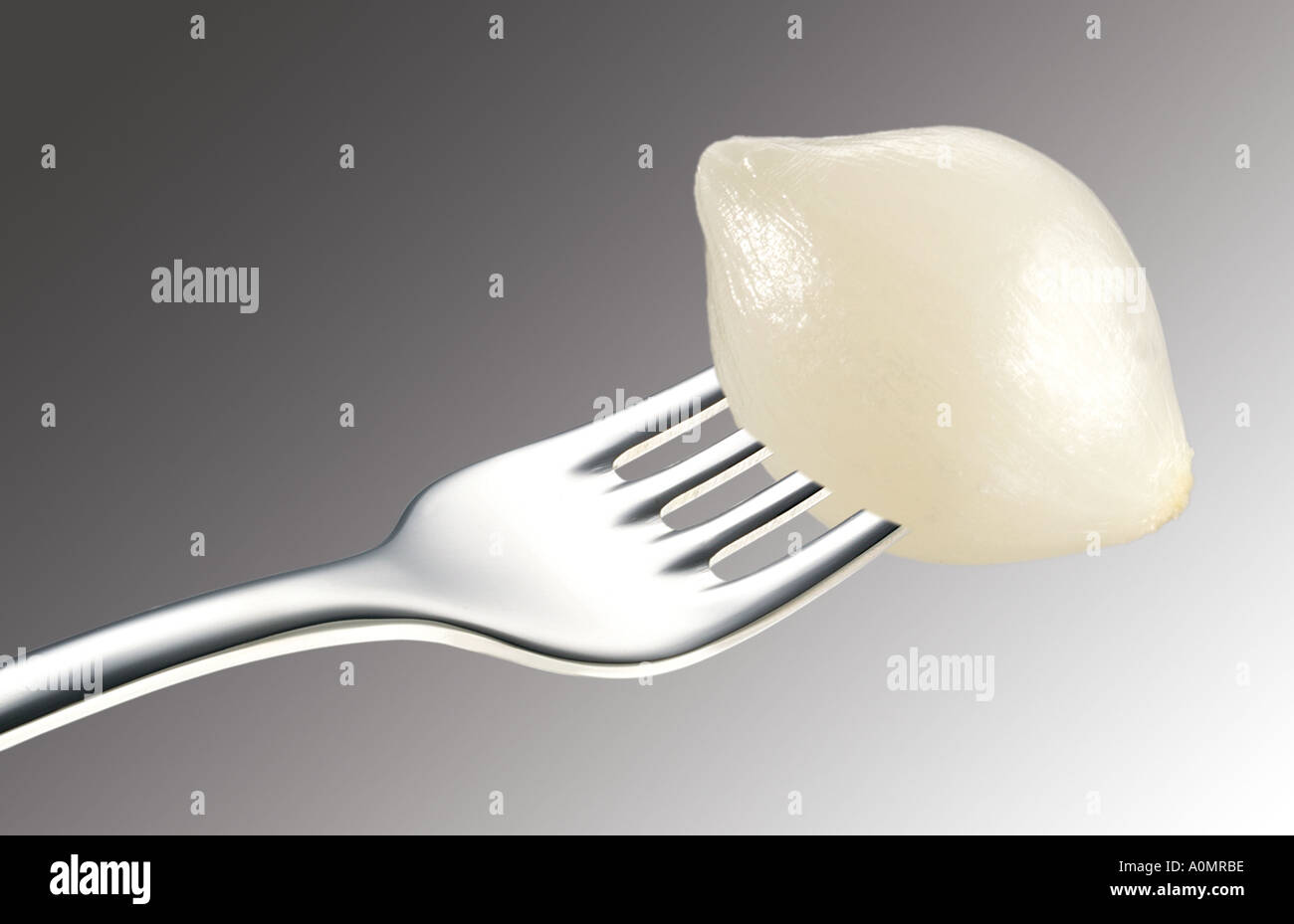 PICKLED ONION ON FORK Stock Photo