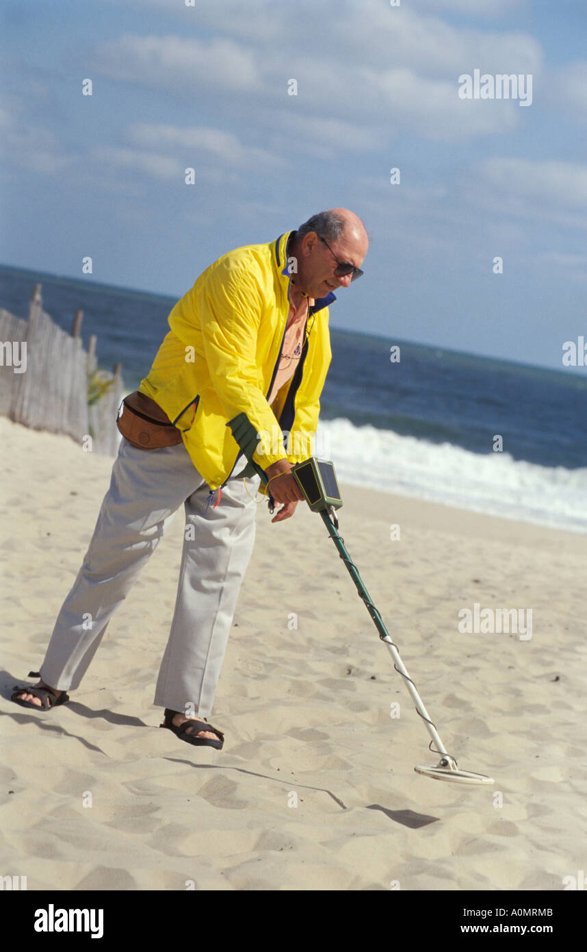 1 one man male senior citizen retired retiree hunts tresure on sand sandy beach Rehoboth Beach Delaware USA beachcomber Stock Photo