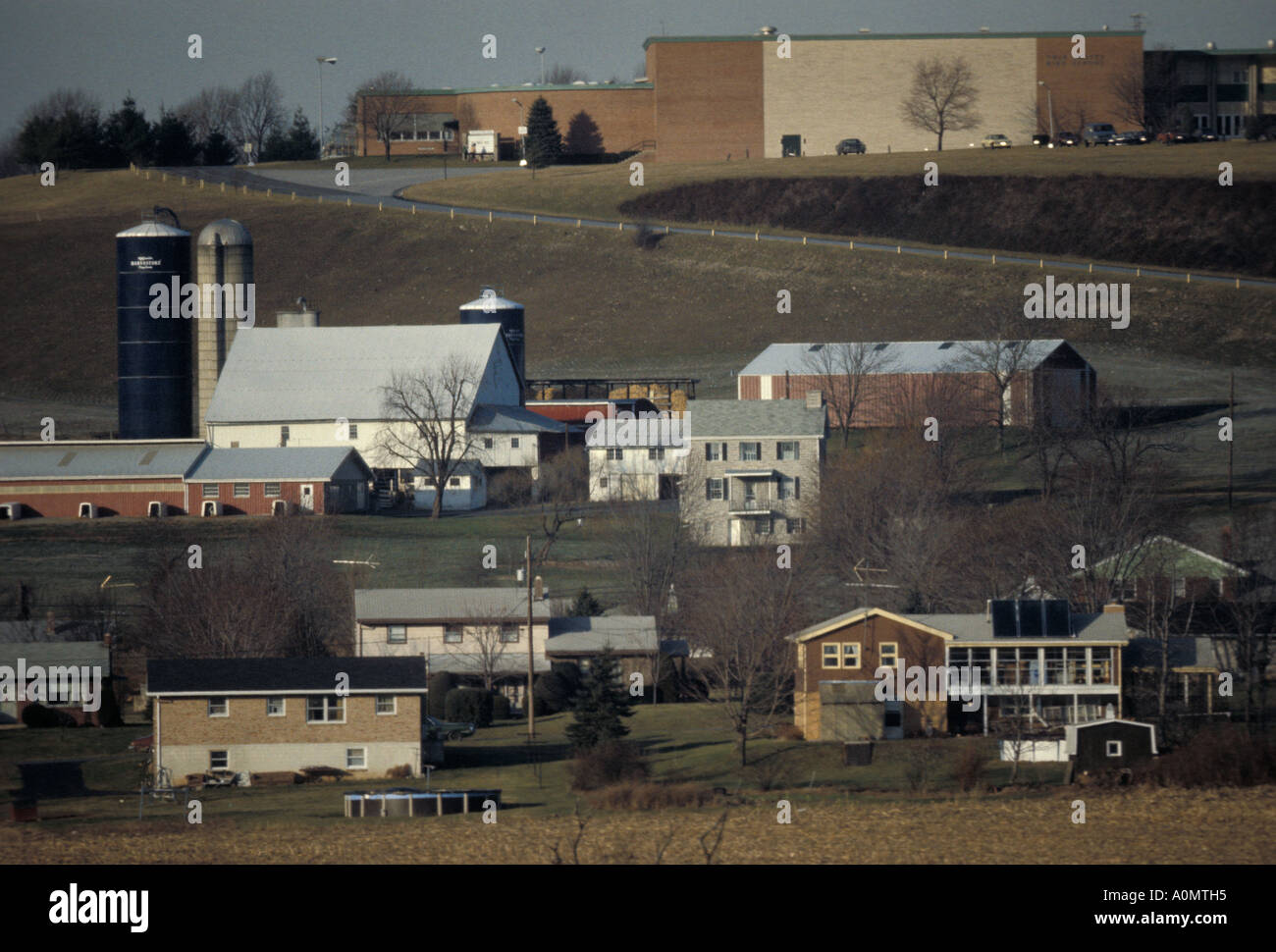 school farm houses crowded overcrowding rural loss of farm land urban sprawl landscape outside outdoor Stock Photo