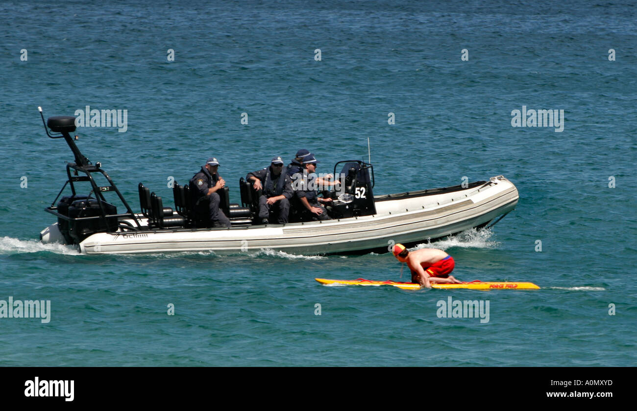 Heavily armed Special Police patrol by boat at Cronulla Sydney Australia Stock Photo