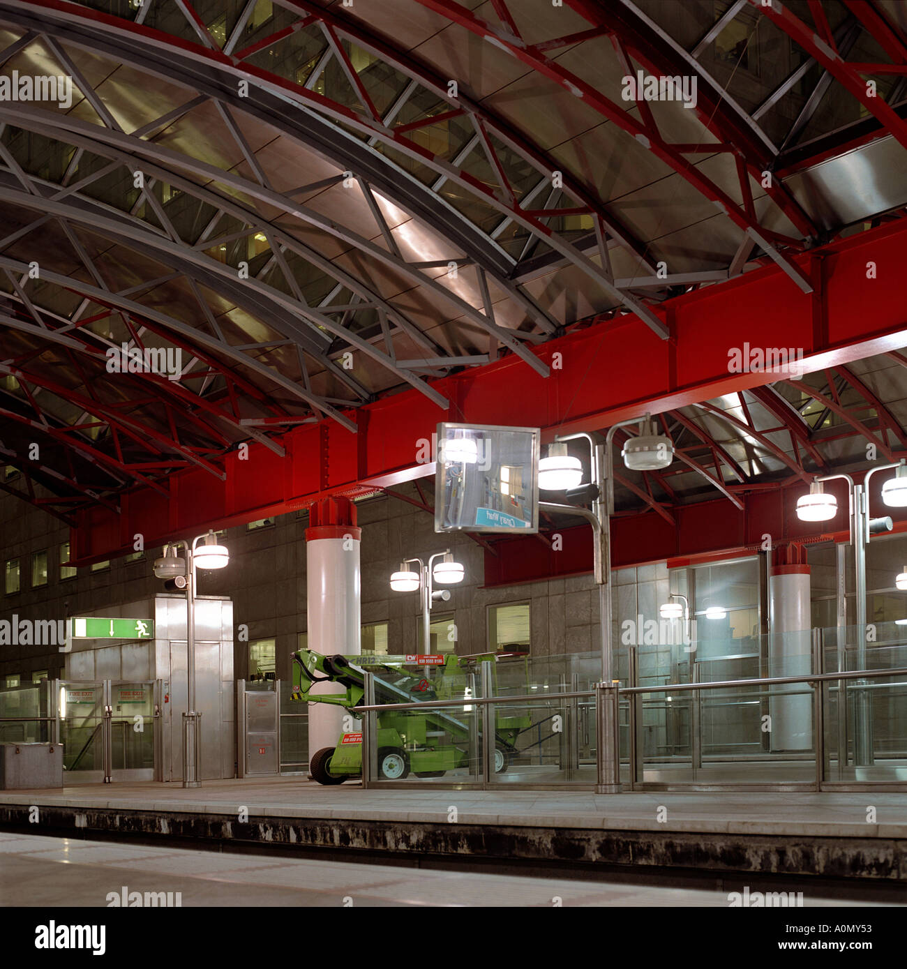 Night shot of platform at DLR platform, Canary Wharf Station,Tower Hamlets, London, UK inc. elliptical glass metal roof Stock Photo