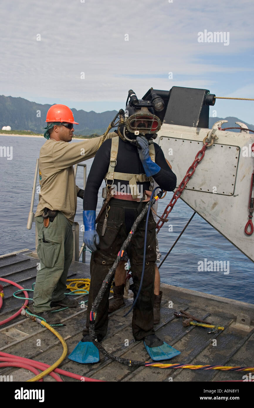 A commercial hard hat diver (MR) prepares for a dive Oahu, Hawaii Stock