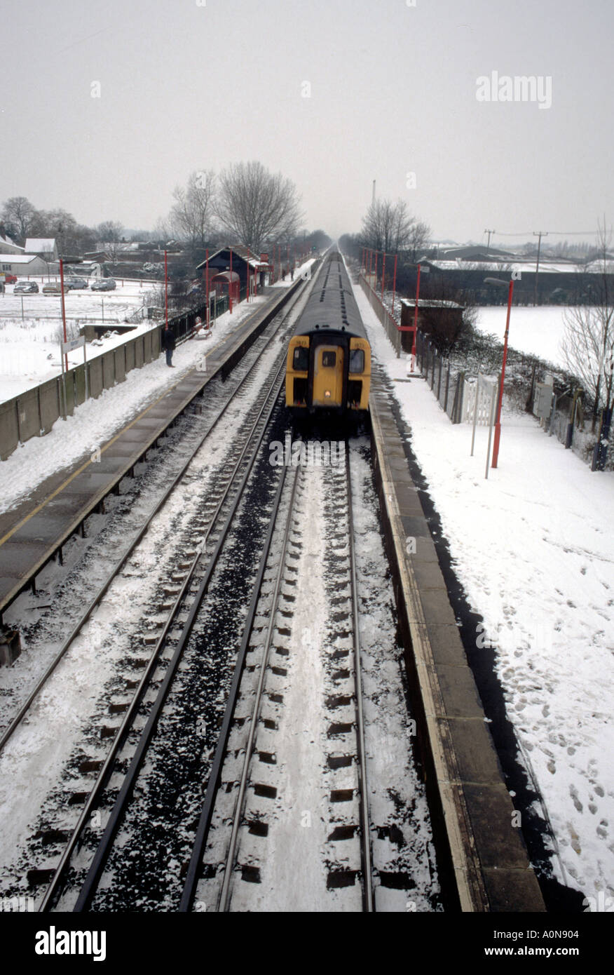 Slam door train in the snow UK Stock Photo