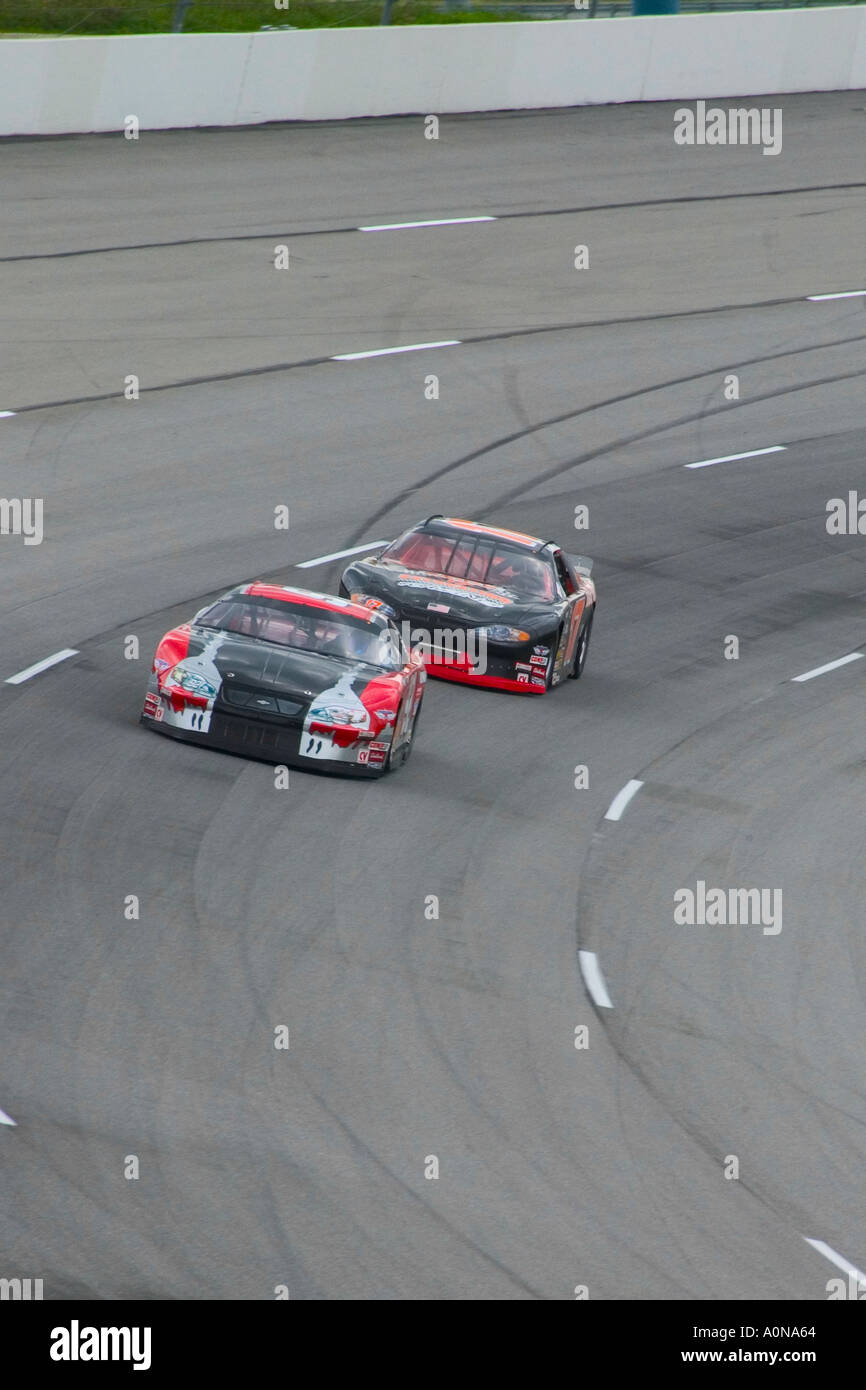 NASCAR drivers Dave Stremme and Johnny Benson rounding third turn at Kentucky Speedway during practice runs prior to Meijer 300 Stock Photo