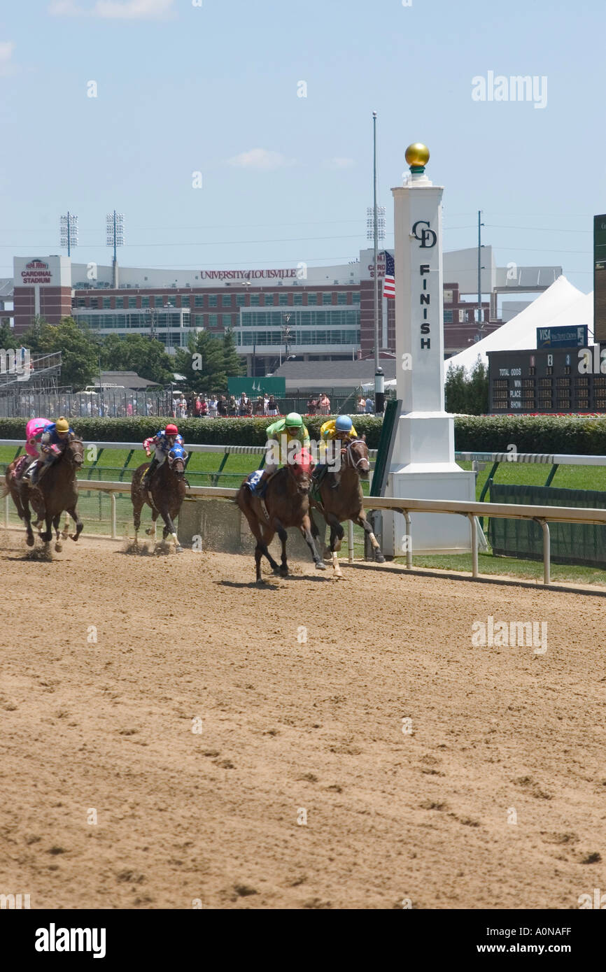 Race horses crossing the finish line at Churchill Downs during race