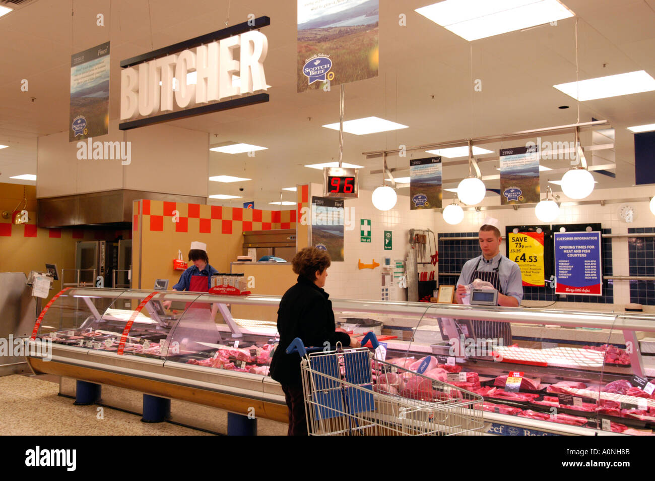 The butcher counter at Tesco Extra superstore England UK Stock Photo