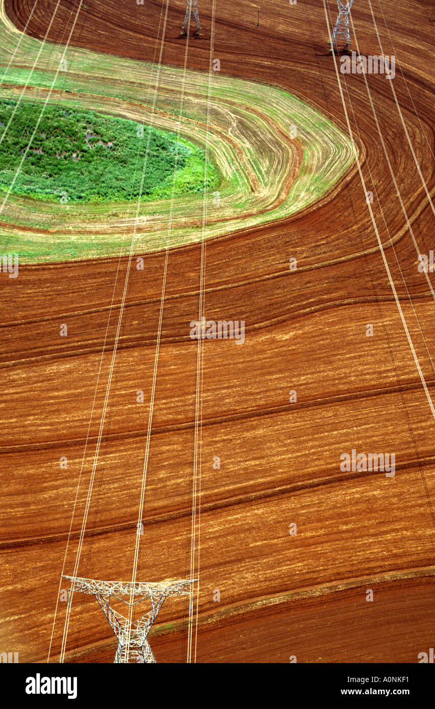 Parana State, Brazil. High voltage pylons and electricity lines on agricultural land from Itaipu hydroelectric dam. Stock Photo