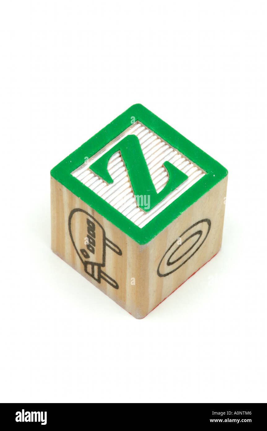 Children wooden learning block showing green alphabet Z on white background Stock Photo