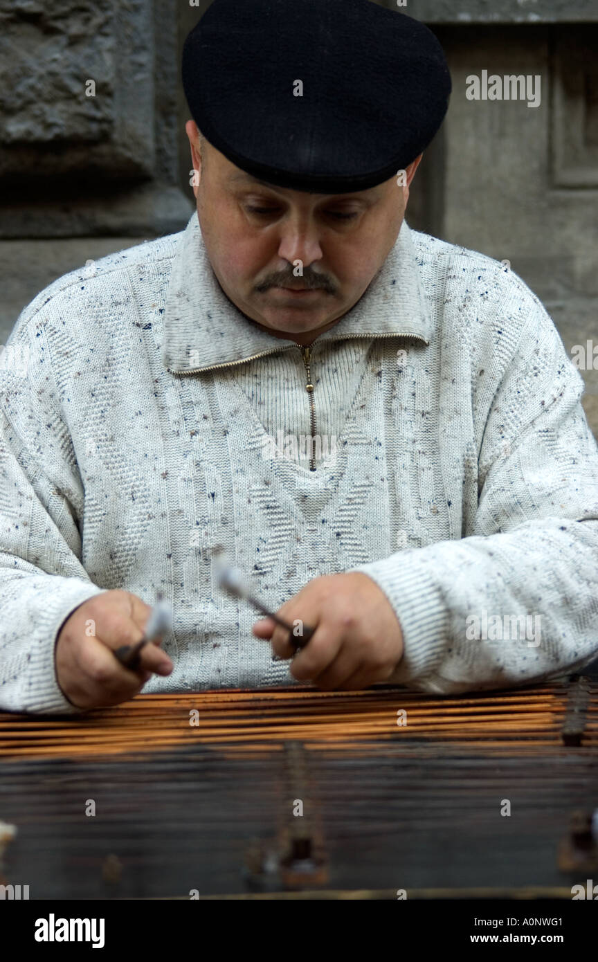man playing the Hammer Dulcimer in milan cimbalon player milan